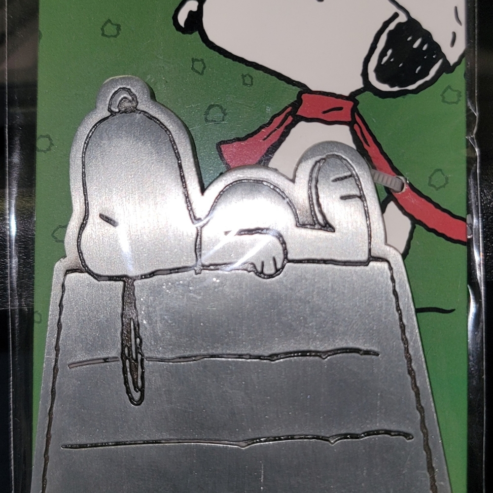 Snoopy metal bottle opener.